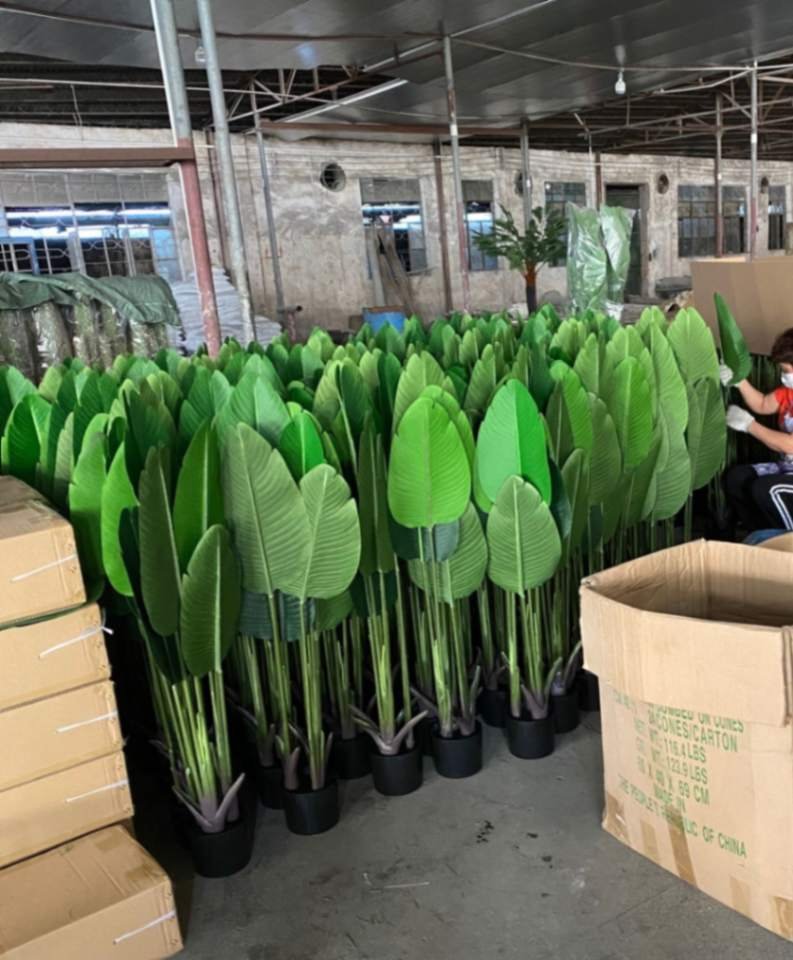 Multiple artificial plants in factory assembly line