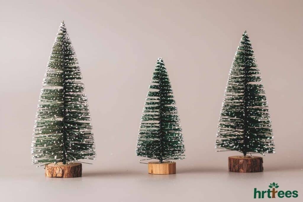 Base secured artificial pine tree