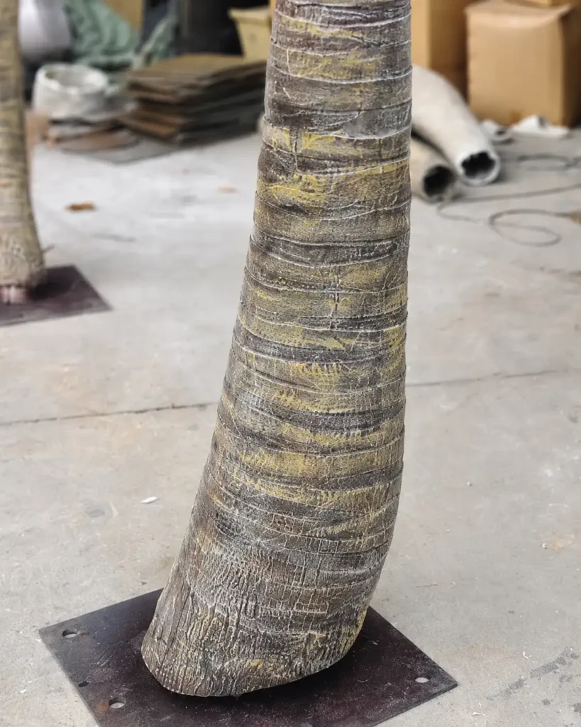 Close-up detail of a fiberglass artificial palm tree trunk for commercial landscape projects